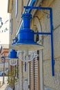 Blue electric lamps at the old house in Cres town port
