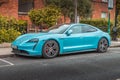 Blue electric Porsche Taycan parked in Dublin, Ireland