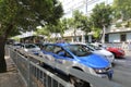 Blue electric taxis in crowd street of shenzhen city