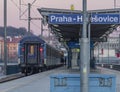 Blue and yellow electric and diesel train in Holesovice station in capital Prague Royalty Free Stock Photo