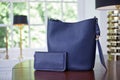 Blue elegant leather hand bag and purse in luxury interior