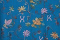 Blue embroidered floral fabric background