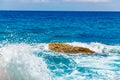 Blue emerald sea water with large stones beach. Rocky shore transparent turquoise bottom Malta Royalty Free Stock Photo