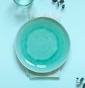 Blue empty plate flat lay with napkin on the table. Table settings composition