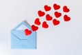 Blue envelope and flying red hearts, love letter