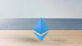 Blue Ethereum gold sign icon on wood table blur sea with the sky. 3d render illustration, cryptocurrency, crypto, business, Royalty Free Stock Photo