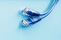 Blue Ethernet Cable Cord Patch cord on a blue background with free space Royalty Free Stock Photo