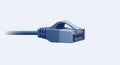 Blue Ethernet cable with an RJ45 connector, featuring eight metal contacts for Royalty Free Stock Photo