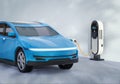 Blue ev car or electric vehicle plug in with recharging station Royalty Free Stock Photo