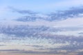 blue evening sky with spindrift clouds at dusk