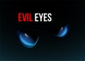 Blue evil eyes on black background Royalty Free Stock Photo