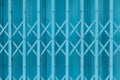 Blue expandable steel gate showing a traditional folding mechanism Royalty Free Stock Photo