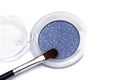 Blue eye shadows and eye brush crushed samples isolated on white background Royalty Free Stock Photo
