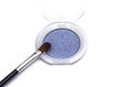 Blue eye shadows and eye brush crushed samples isolated on white background Royalty Free Stock Photo