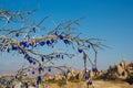 Blue eye stones on wood. Rock churches and pigeon lofts. Sword valley, Goreme, Cappadocia, Anatolia, Turkey