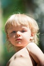 Blue-eyed baby boy on nature portrait Royalty Free Stock Photo