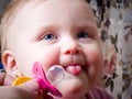 Blue-eyed Baby grabbing binky Royalty Free Stock Photo