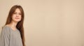 blue eyed brown haired shy girl in t-shirt. Studio model shot Royalty Free Stock Photo