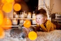 a blue eyed cute boy lying thoughtfully with grey rabbits around Royalty Free Stock Photo