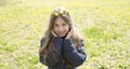 Cute smiling little girl with flower wreath on the meadow Royalty Free Stock Photo