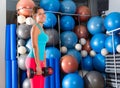 Blue eyes girl at gym weightlifting dumbbells Royalty Free Stock Photo