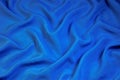 Blue fabric abstract background for design and creativity. Folds of fabric form a natural unique creative, abstract pattern,