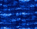 Blue fabric texture, batik pattern, shibori design, seamless pattern. Indigo blue tones.