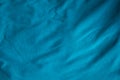 Blue fabric folds texture of natural weave cloth dark teal color fabric natural cotton or linen textile material for seamless Royalty Free Stock Photo