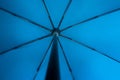 Blue fabric open umbrella mechanism inside point of view concept Royalty Free Stock Photo