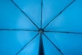 Blue fabric open umbrella mechanism inside point of view concept Royalty Free Stock Photo