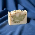 The blue fabric provides a soft contrast enhancing the soap s handcrafted Royalty Free Stock Photo