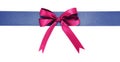 Blue fabric ribbon and violet bow on white background Royalty Free Stock Photo
