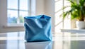 Blue Fabric Storage Bin on White Table in Bright Room Royalty Free Stock Photo