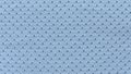 A blue fabric texture of an eyelet baby cloth