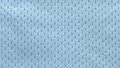 A blue fabric texture of an eyelet baby cloth