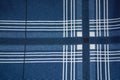 Blue fabric with white and black stripes and squares Royalty Free Stock Photo