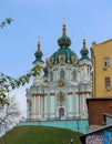 The blue facade of the Church of St. Andrew in Kyiv against the background of the blue sky. Andriyivskyi Uzviz in Kyiv. Royalty Free Stock Photo