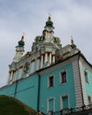 The blue facade of the Church of St. Andrew in Kyiv against the background of the blue sky. Andriyivskyi Uzviz in Kyiv. Royalty Free Stock Photo