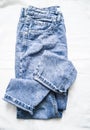 Blue faded mom jeans on a light background, top view. Fashion clothing Royalty Free Stock Photo