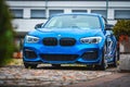 Blue fast BMW sports car outside in the parking lot Royalty Free Stock Photo