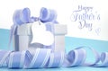 Blue Fathers Day gift with beautiful stripe ribbon and heart shape gift tag Royalty Free Stock Photo