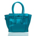 Blue female handbag over white