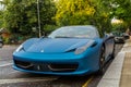 Blue Ferrari 458 parked in street in London