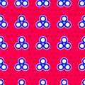 Blue Fidget spinner icon isolated seamless pattern on red background. Stress relieving toy. Trendy hand spinner. Vector Royalty Free Stock Photo