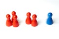 Blue figure first, game pawns with motion blur. Concept for motivation, sport, win, lose or leadership. .