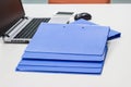 Blue file folder with documents on the white table Royalty Free Stock Photo