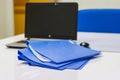 Blue file folder with documents and Notebook on the white table Royalty Free Stock Photo