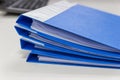 Blue file folder with documents on table in work office Royalty Free Stock Photo