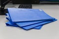 Blue file folder with documents on table in work office Royalty Free Stock Photo