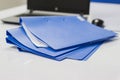 Blue file folder with documents and Notebook on the white table Royalty Free Stock Photo